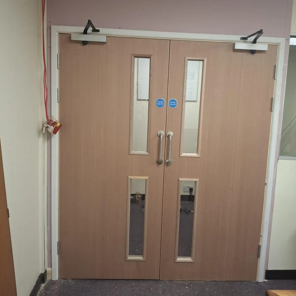 Construction company in Bilston fitting a new fire door