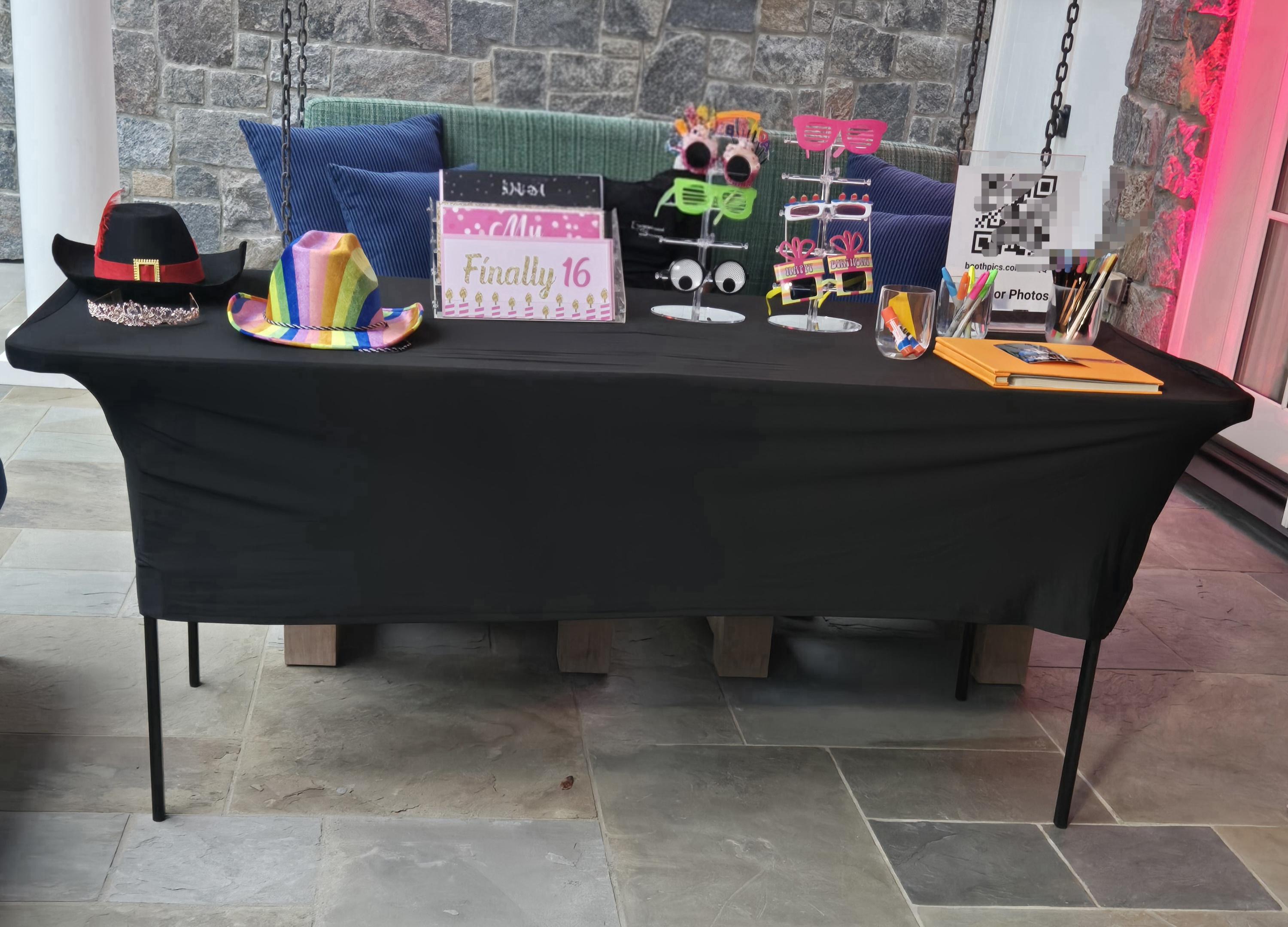 photo booth props displayed on a table at a Sweet 16 event