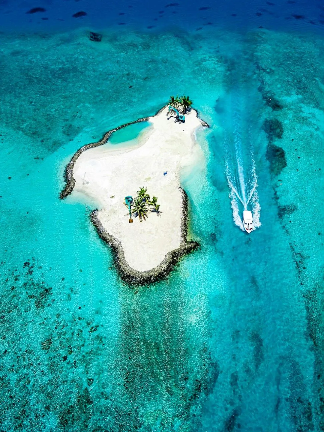 Small harbor with boats representing island hopping.