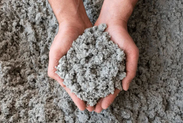 Cellulose insulation showing blown-in texture and filling properties