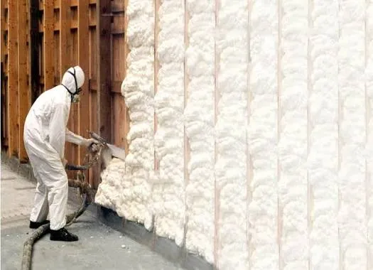 Spray foam insulation expanding inside a stud wall cavity