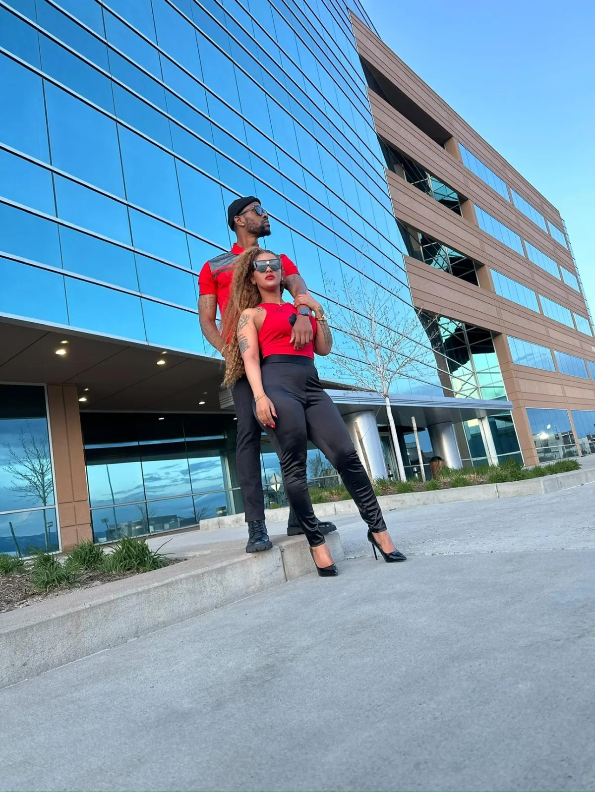 Lifestyle portrait of BizMike on a modern rooftop at golden hour