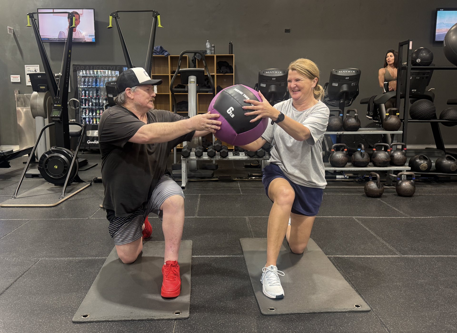 Two clients training together with a medicine ball at Goodlife Burleigh