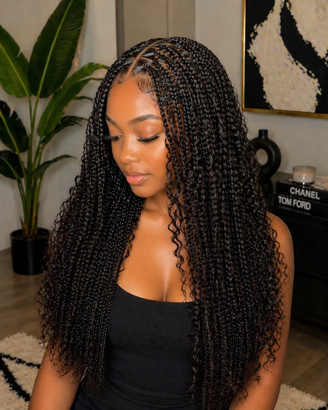 A smiling woman with braided hair and colorful beads.