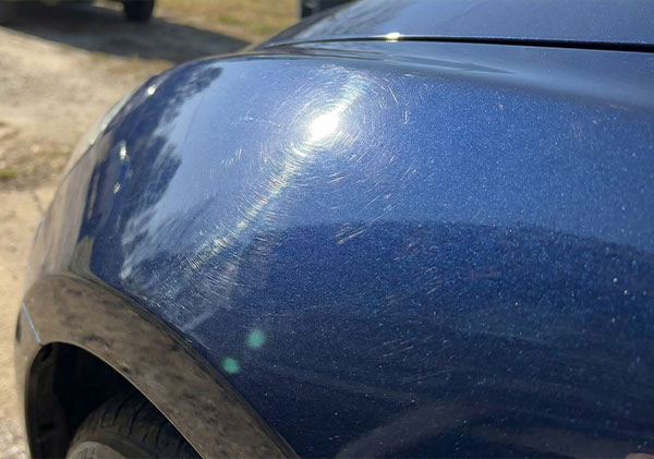 Swirl marks on blue car