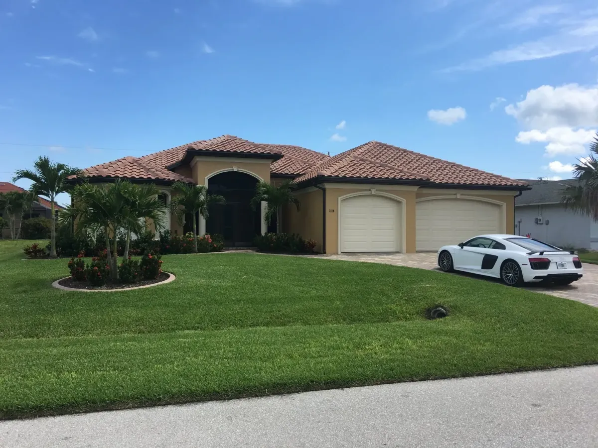 Lawn care for Mediterranean-style home in Deerfield Beach – Quality Lawncare & Landscaping