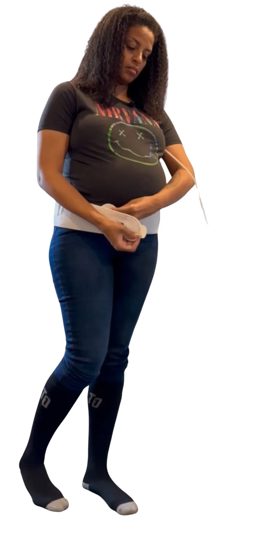 A soft, ergonomic low back support cushion in pastel blue, resting on a nursery rocking chair. The cushion’s contours are highlighted by gentle sunlight, suggesting relief and relaxation.