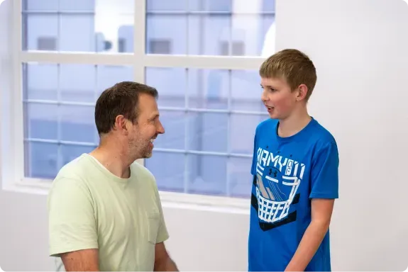Pediatric Physical Therapist Talking To A Child