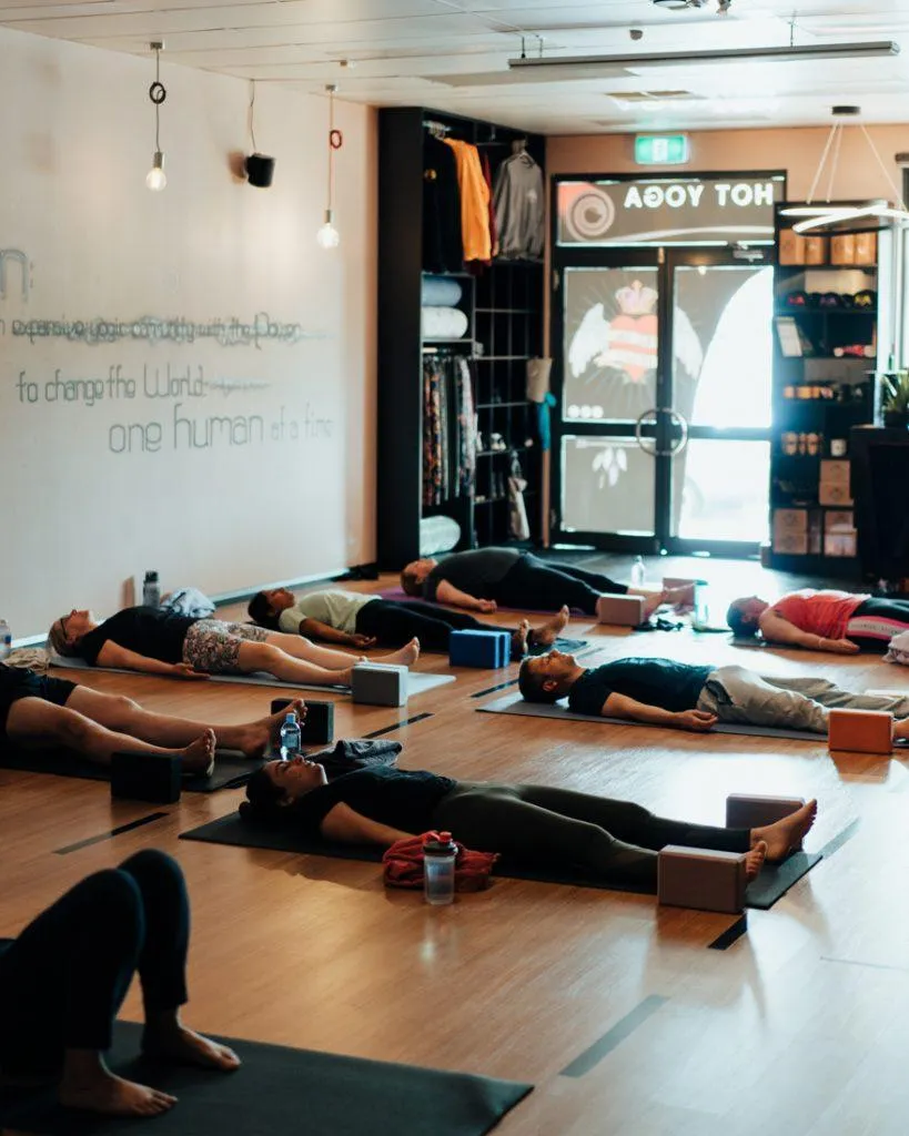 People lying awake at the studio in a restorative breathwork to release stress
