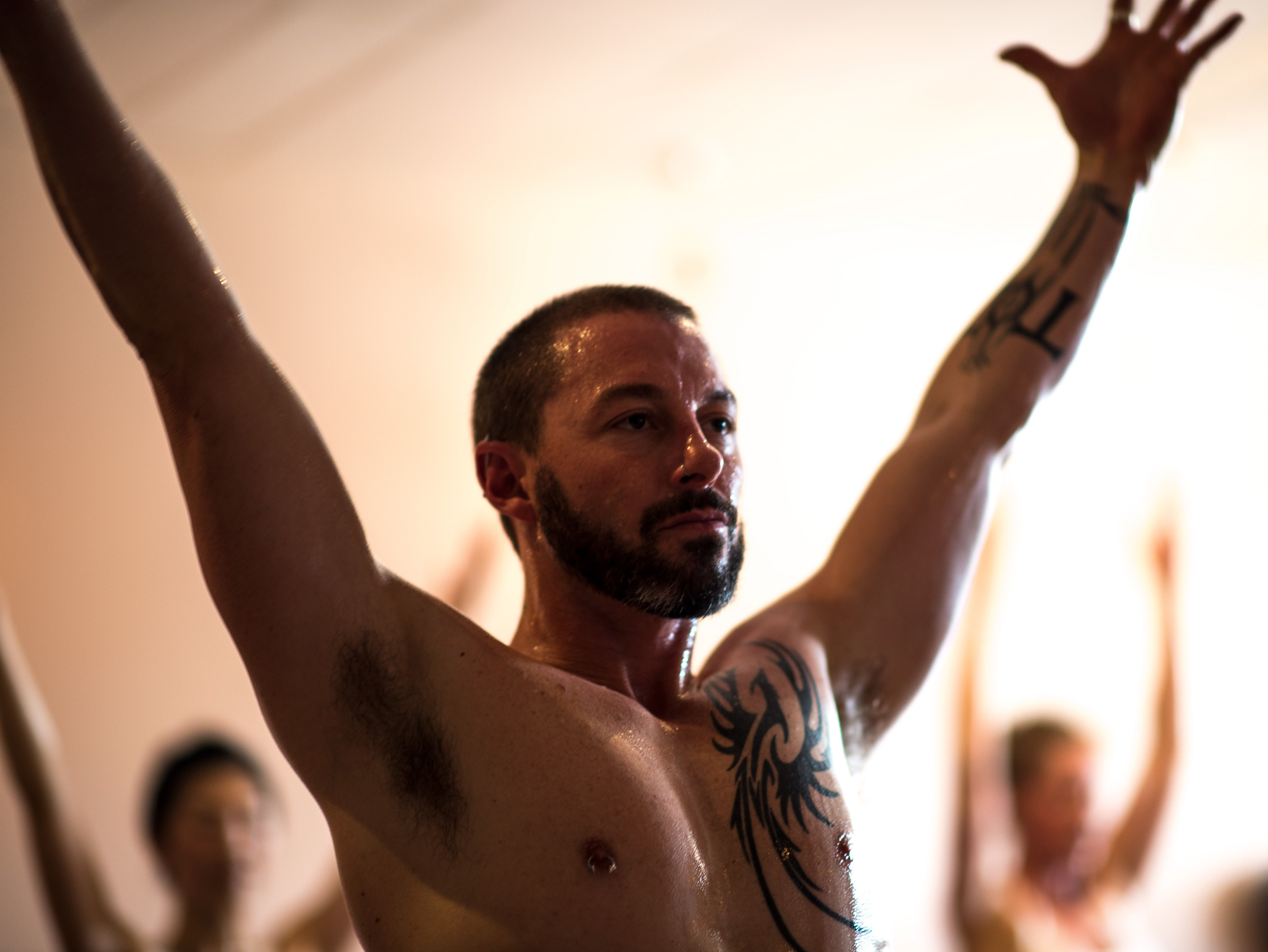 Karl Palin performing a powerful yoga pose at One Big Heart, highlighting strength and mobility training.