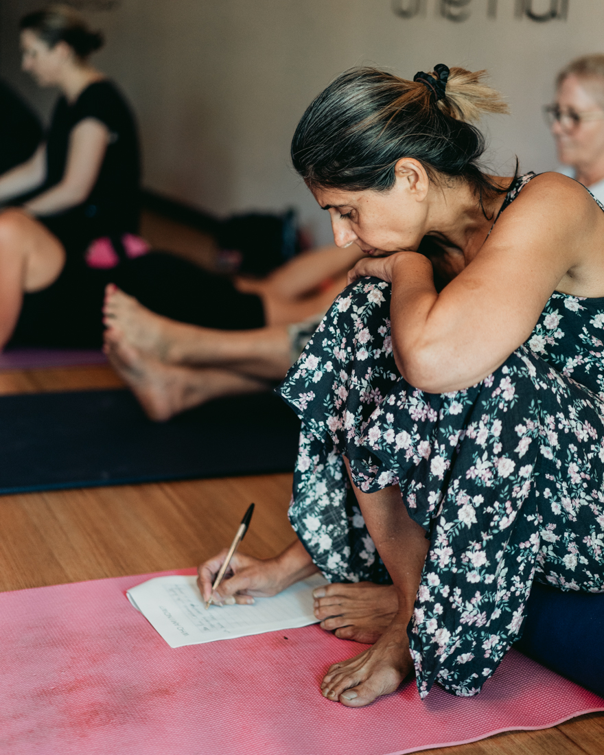 Man in a deep yoga stretch at One Big Heart, increasing flexibility and releasing tension.
