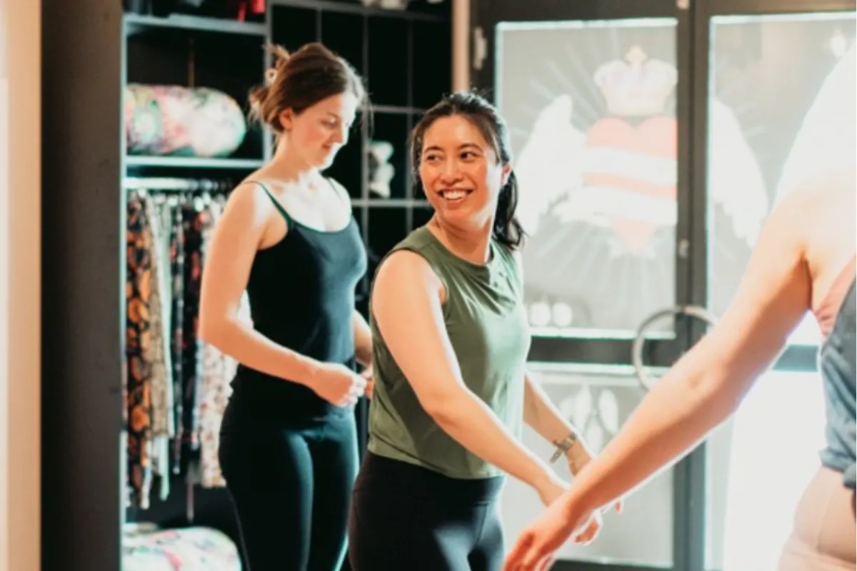 Person joining a yoga class to return to practice after a break, calm morning light