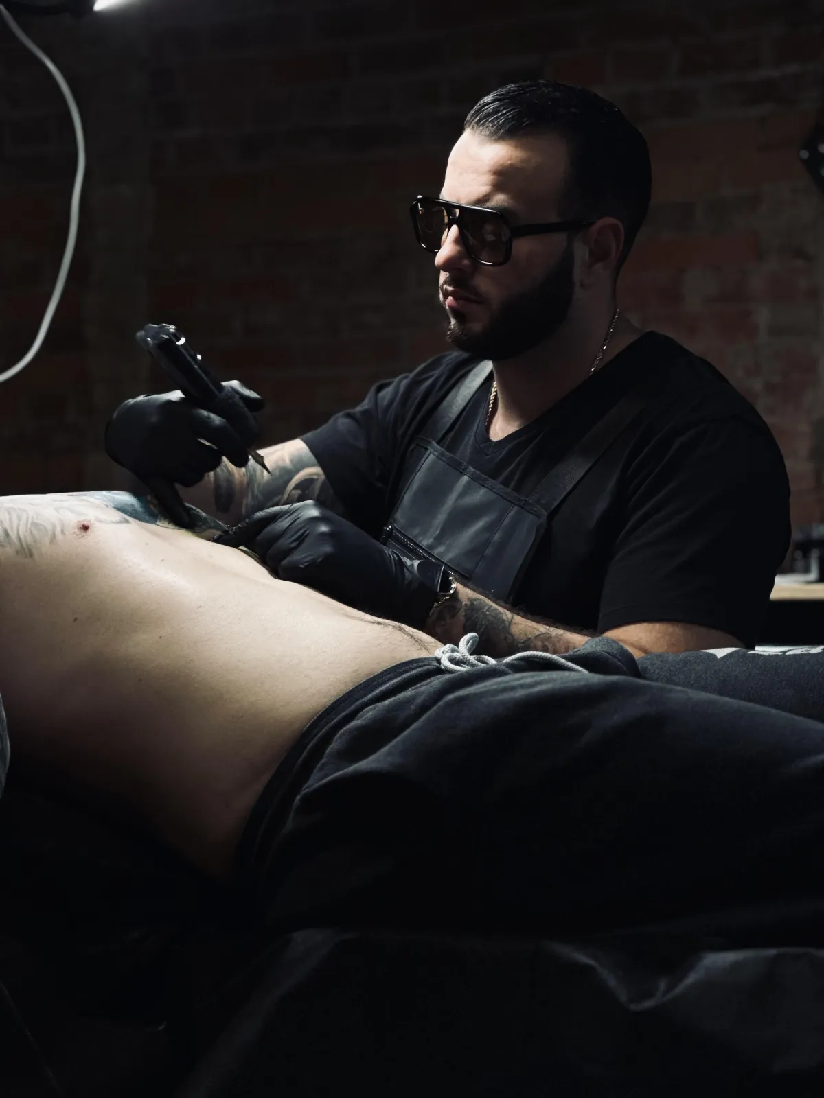 Tattoo expert showcasing detailed mandala design on back of head