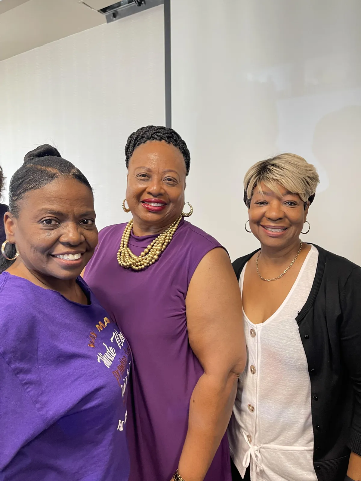 Pastor Dr. Dorothy Ross speaking to a group of women in a warm setting