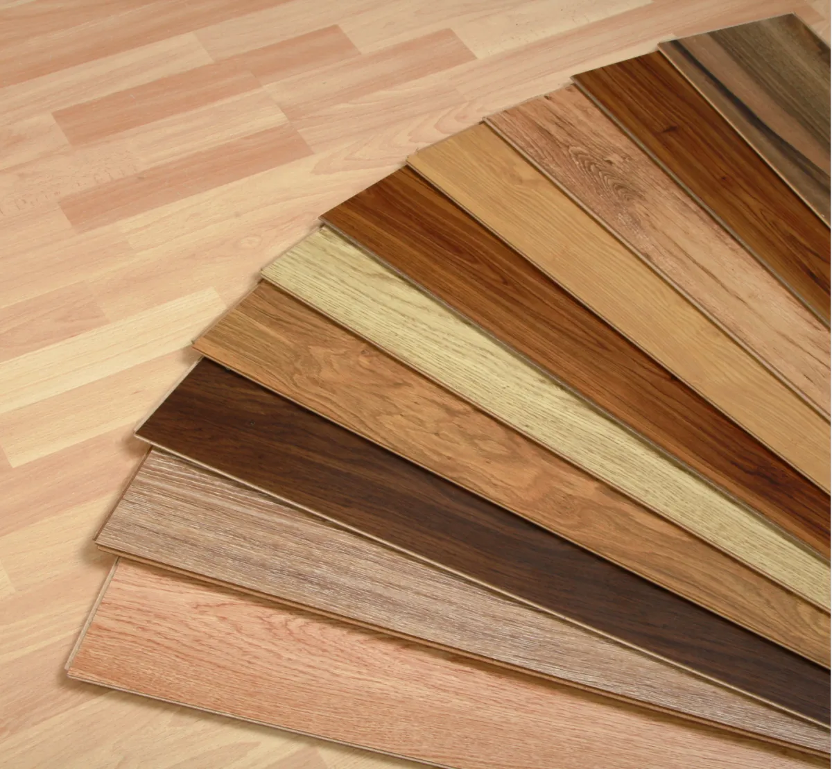Assorted hardwood flooring samples in different wood tones and finishes