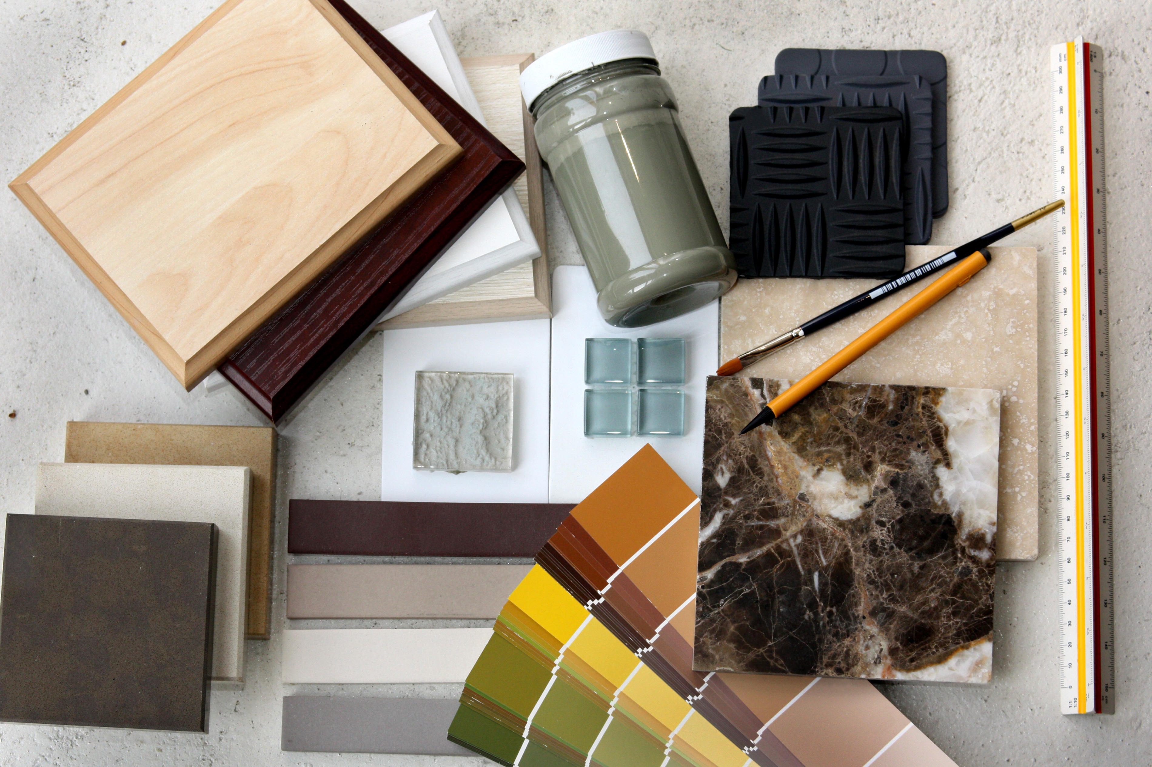 Curated flooring samples, wood finishes, tile, and material swatches for custom flooring projects
