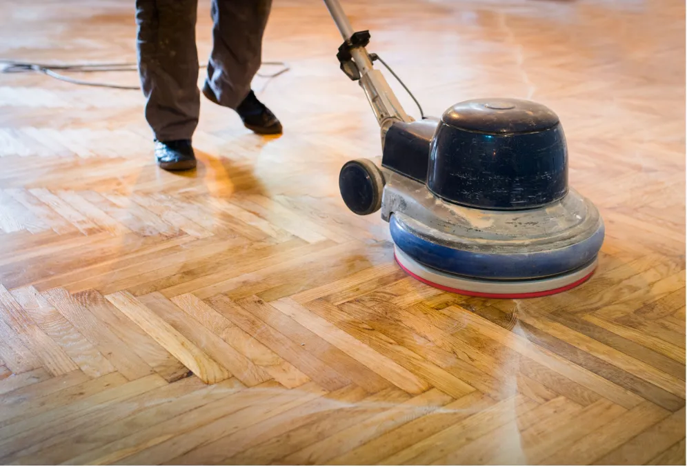 Professional hardwood floor refinishing and sanding in progress