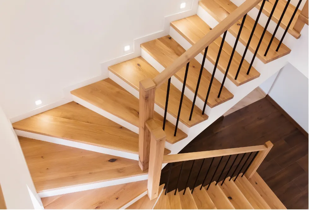 Custom wood staircase showcasing detailed finish carpentry