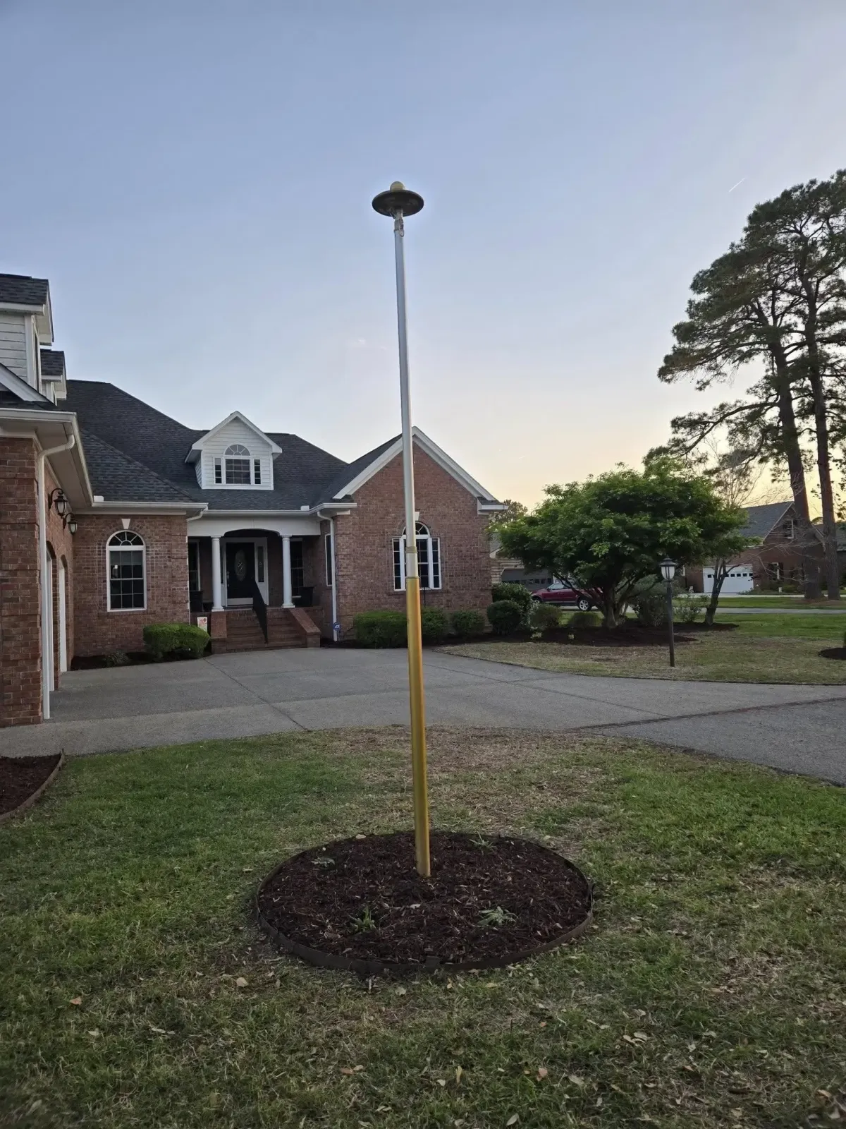 Landscaped yard with lamp post