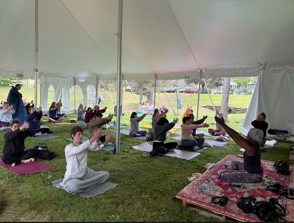Women smiling together on yoga mats