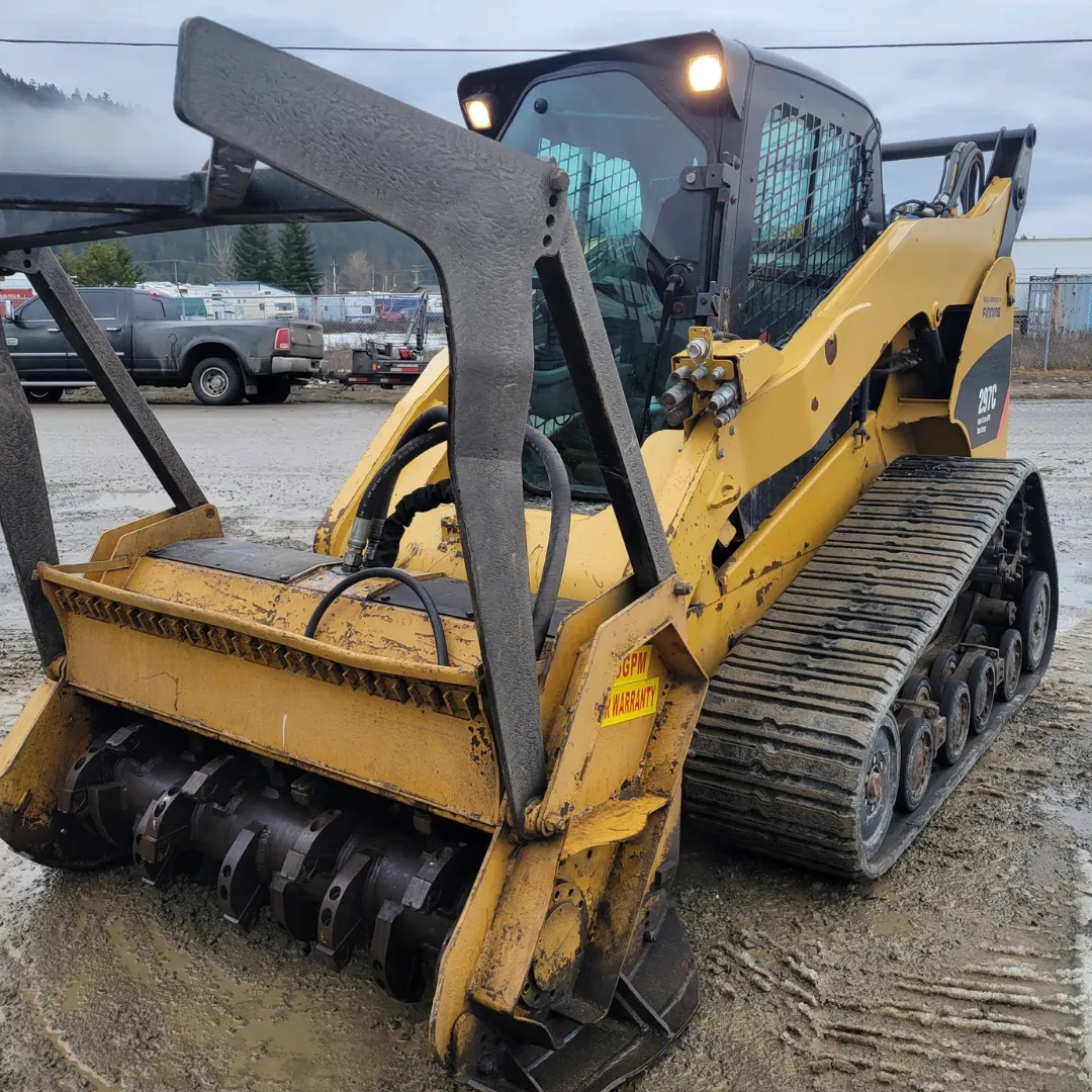 Rayco forestry mulcher attachment on skid steer for professional land clearing and forestry services