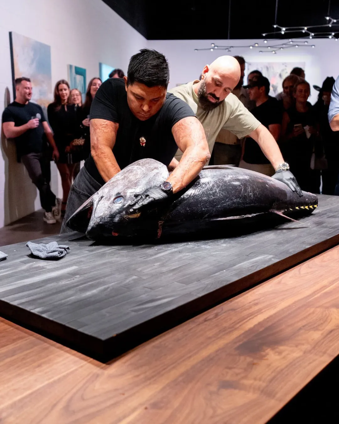 A black-and-white shot of a man playing electric guitar in double exposure