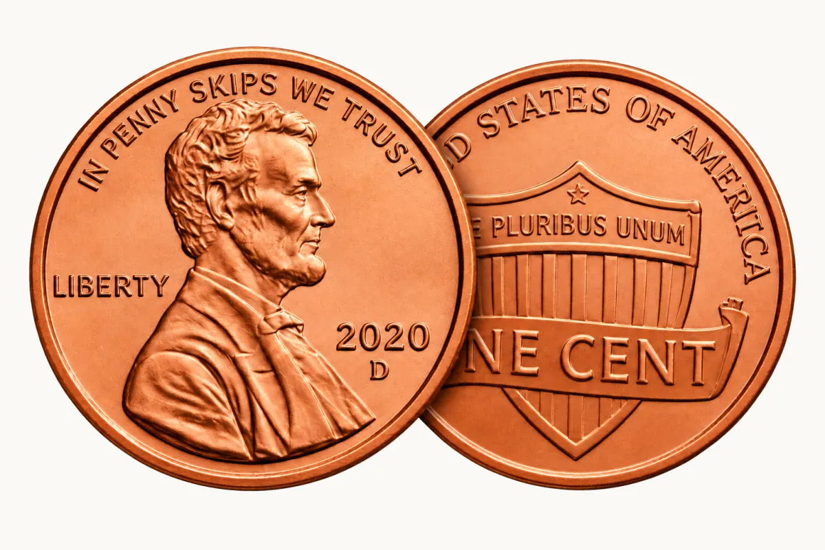 Two copper pennies; the front penny reads In Penny Skips We Trust and is dated 2020