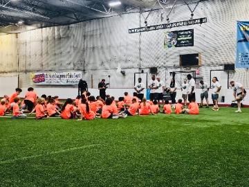 A group of children participating in a youth sports camp