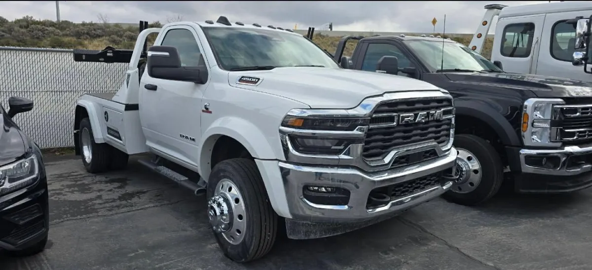 a black car parked on the side of a street