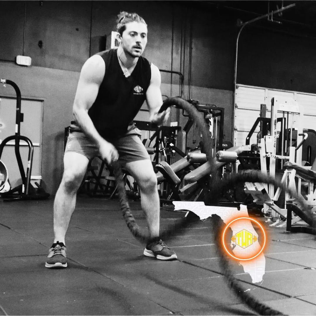 Close-up of a man gripping a barbell in a gym, showcasing strength and focus, overlaid with an image of a clean, modern fitness facility with treadmills and weight machines, representing Reuben Weiner Fitness’ commitment to personalized training and high-performance results in Central Florida.