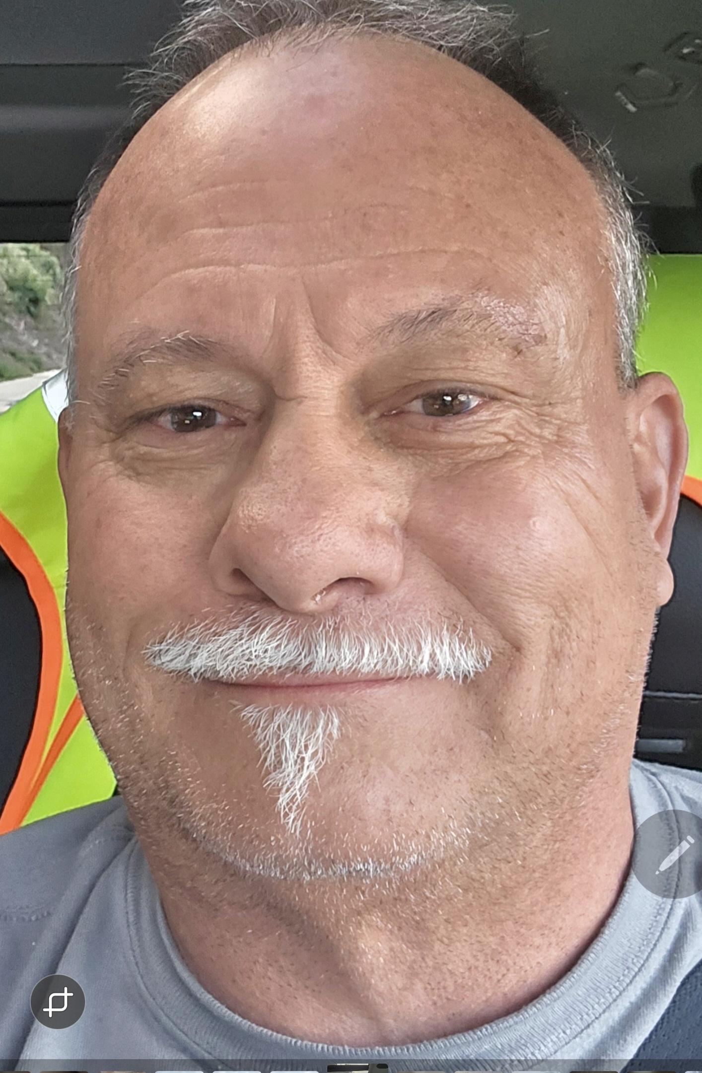 Portrait of a RedRock Demolition project manager, helmet and safety vest, representing trust and local expertise.