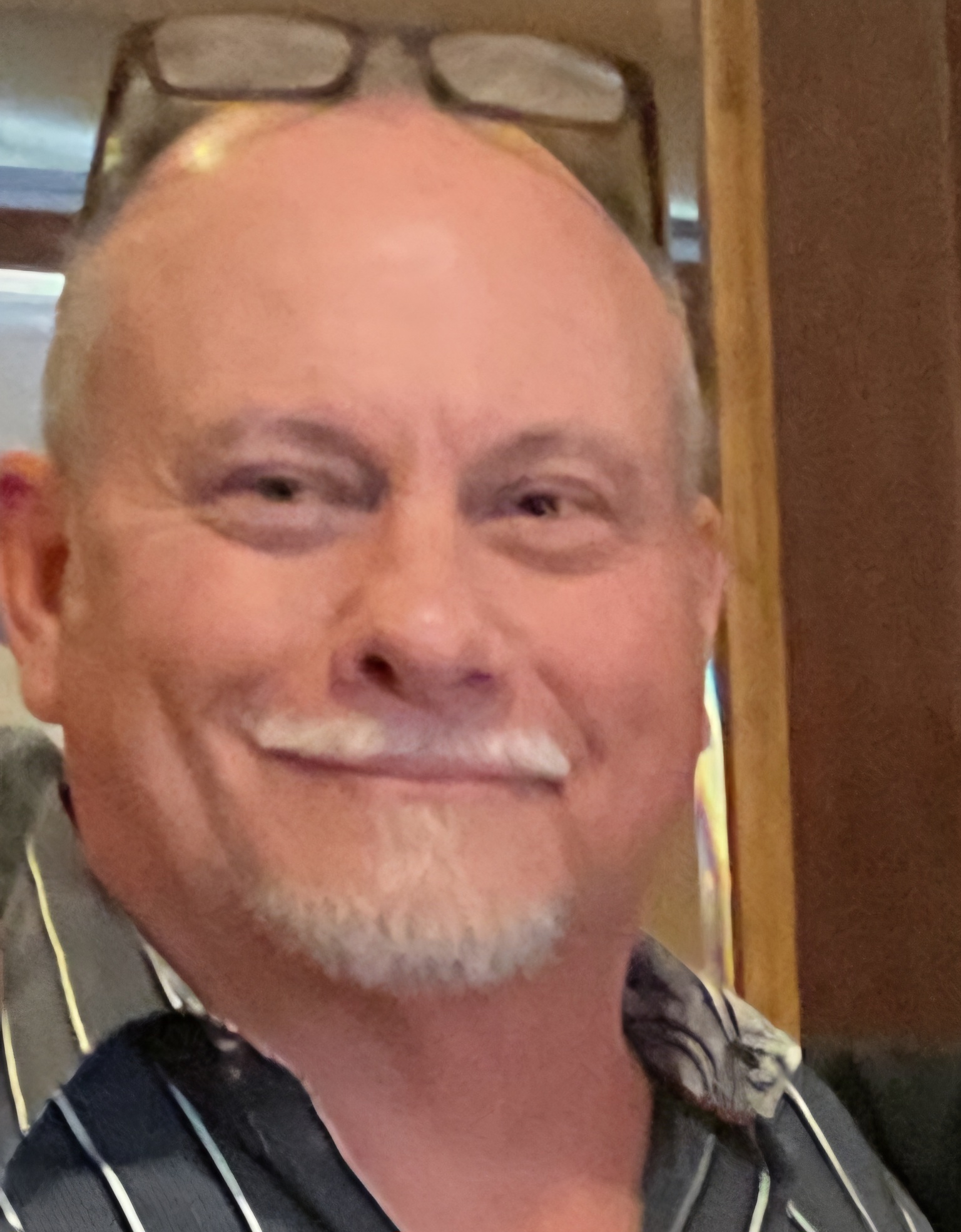 Portrait of a RedRock Demolition project manager, helmet and safety vest, representing trust and local expertise.