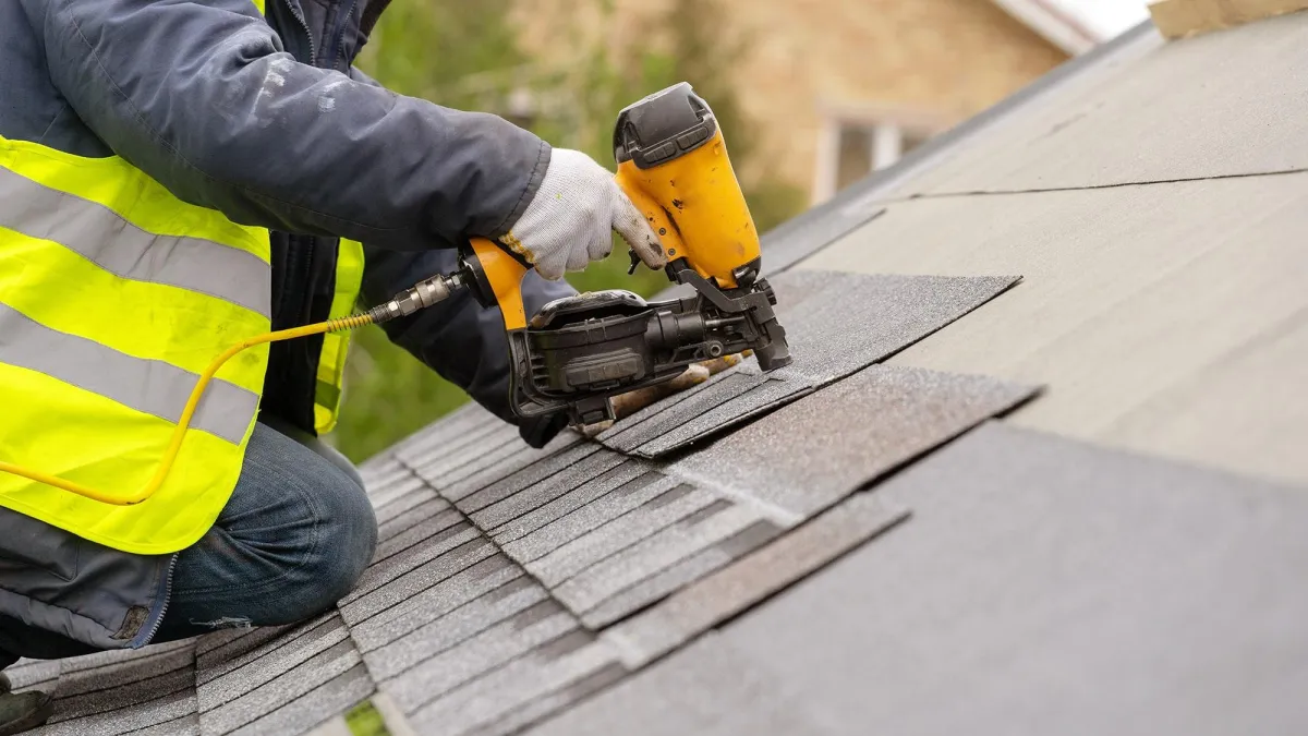 an expert roofer installing a roof