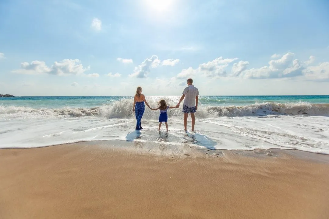 Family walking on beach