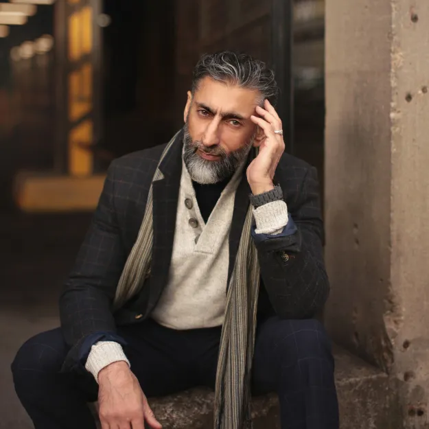 Mentor sitting down engaged in a serious conversation