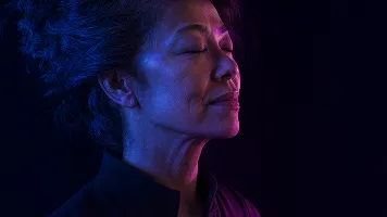 Woman looking up in blue lighting