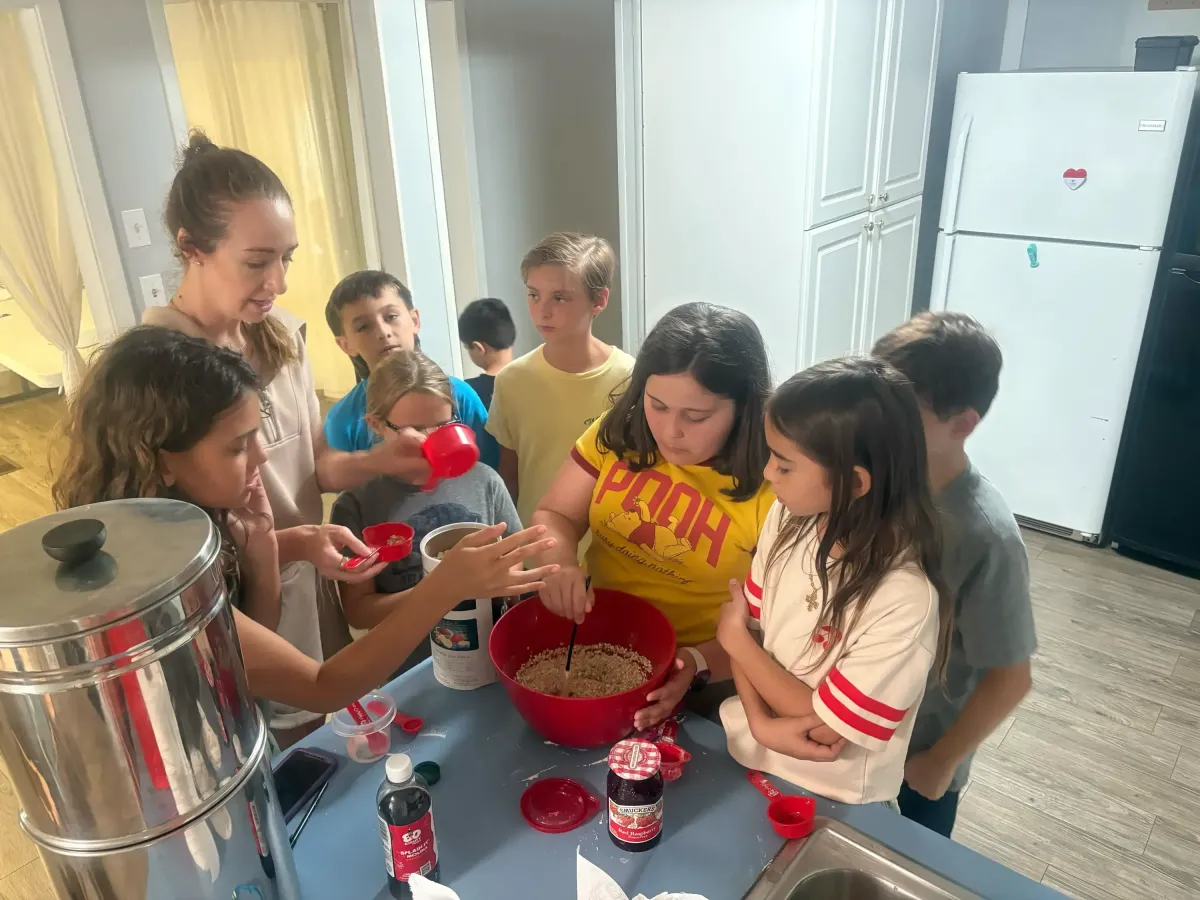 students baking together in a school kitchen