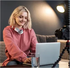Woman using laptop at desk