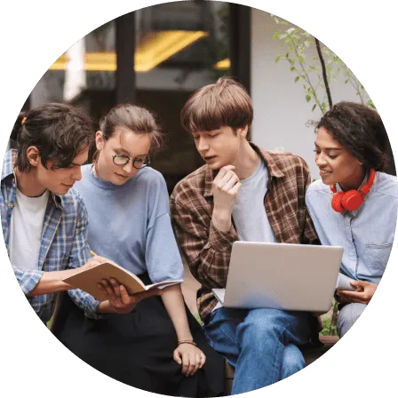 Group of diverse colleagues collaborating on a laptop