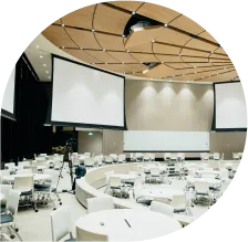Empty conference hall with screens and tables