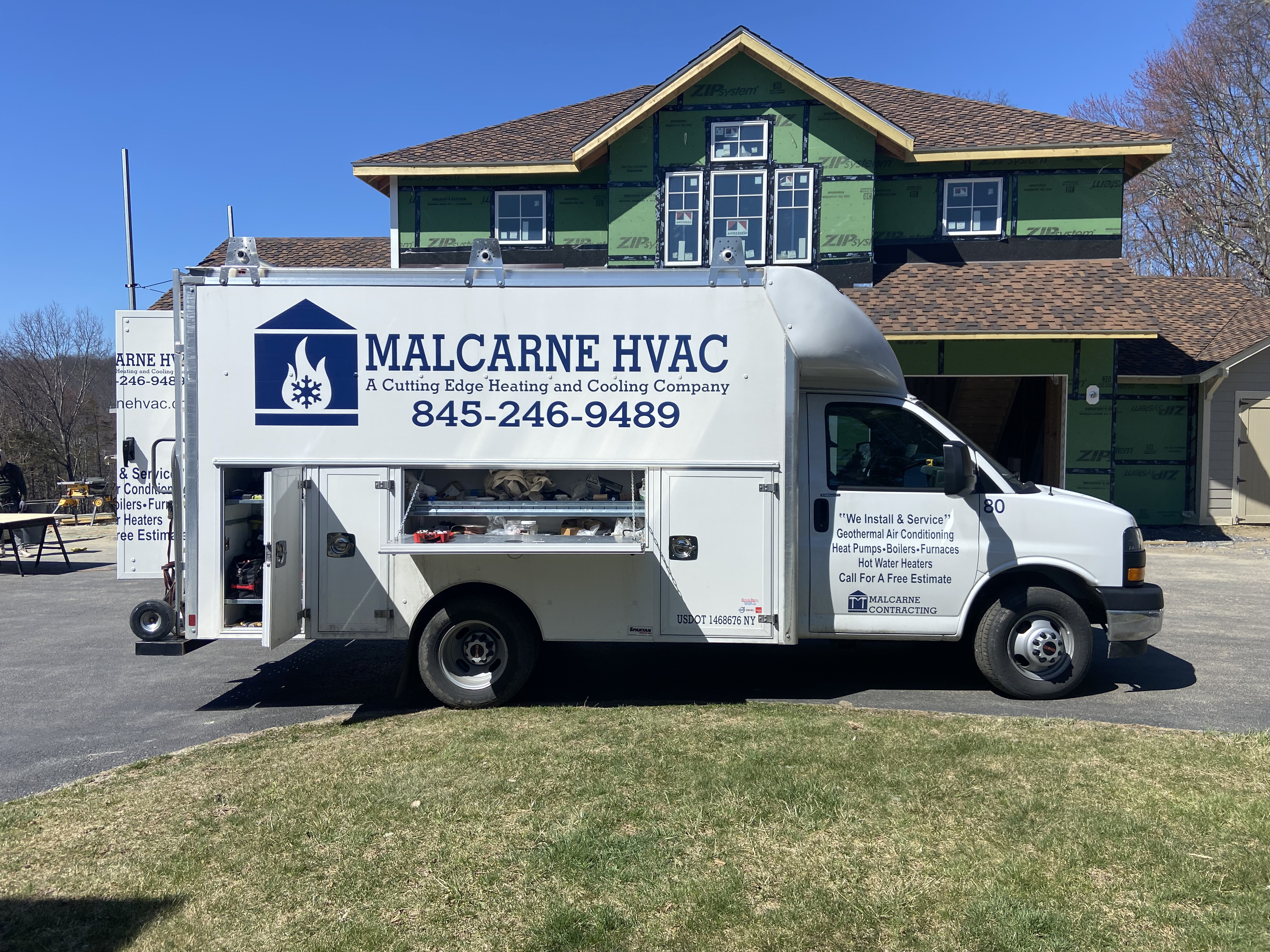 Tall apartment building with balconies under stormy sky