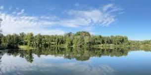 Lakefront composite deck with cable rail and stairs in Portage Lakes