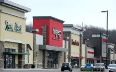 Backyard wood deck with pergola and dining set in Plain Township Canton