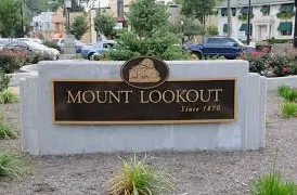 Elevated wood deck with dining table and stairs in Mt. Lookout Cincinnati