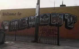 Rooftop deck with modern railing and chairs on Tremont home