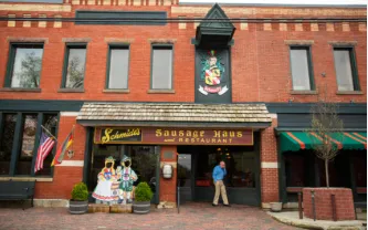 Compact porch deck with black iron rail in German Village Columbus