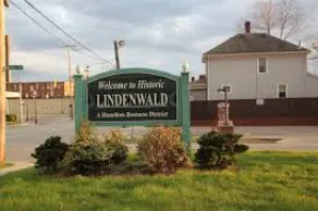 Small backyard deck with wood railings and grill station in Lindenwald Hamilton