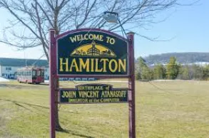 Multi-level deck with bench seating and privacy panel in West Side Hamilton