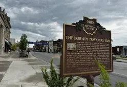 Rooftop deck with modern railing and furniture on Downtown Lorain townhouse
