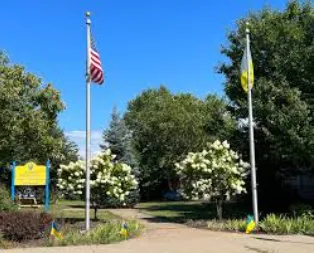 Small front porch deck with wood railings in Ukrainian Village Parma